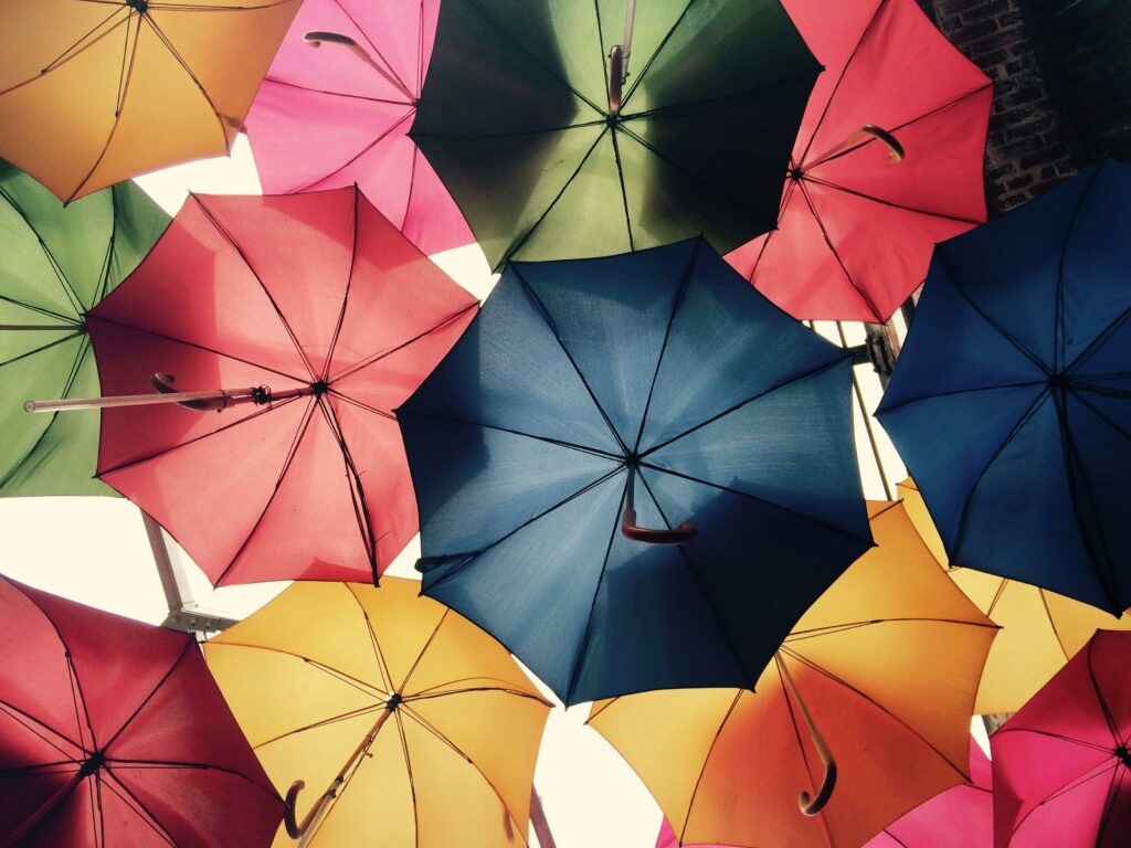 Umbrellas. Photo by Pixabay: https://www.pexels.com/photo/umbrella-lot-268941/